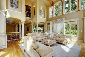 Impressive high ceiling living room with antique furniture, columns and balcony