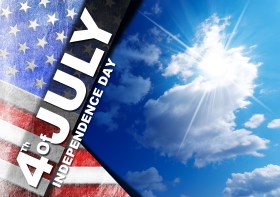 US flag on blue sky with clouds and sunlight with phrase 